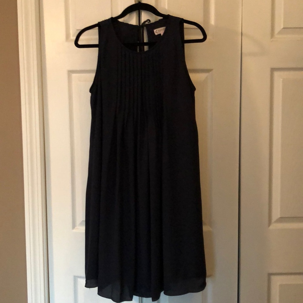 Deep navy blue sleeveless dress.